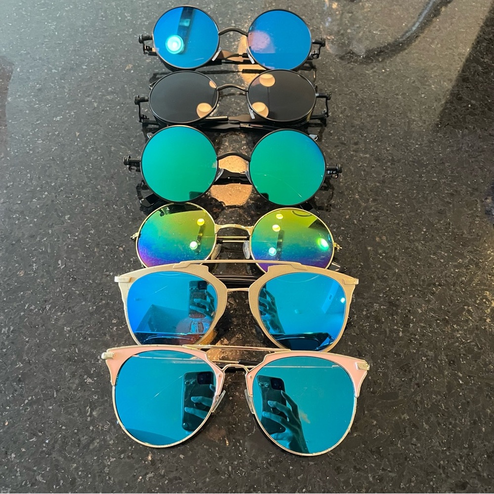 6 pairs of new and used sunglasses with plenty of different styles and colors!